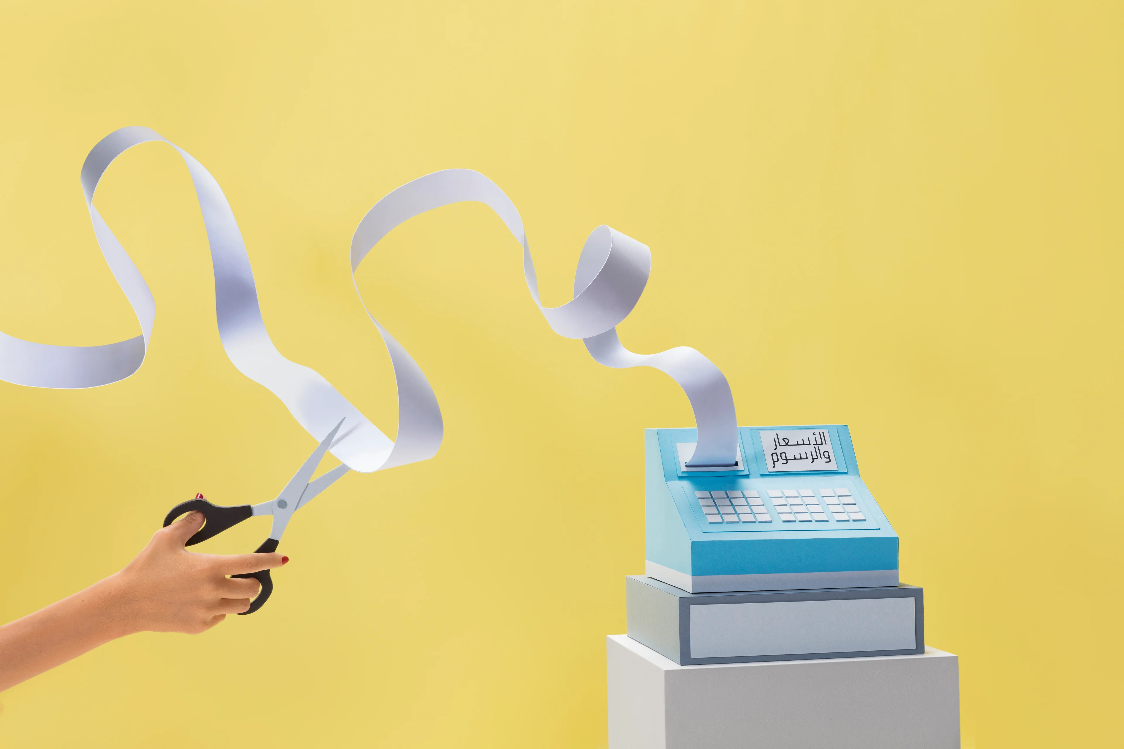 Shop & Ship paper-craft receipt and scissors visualising shipping rates and fees