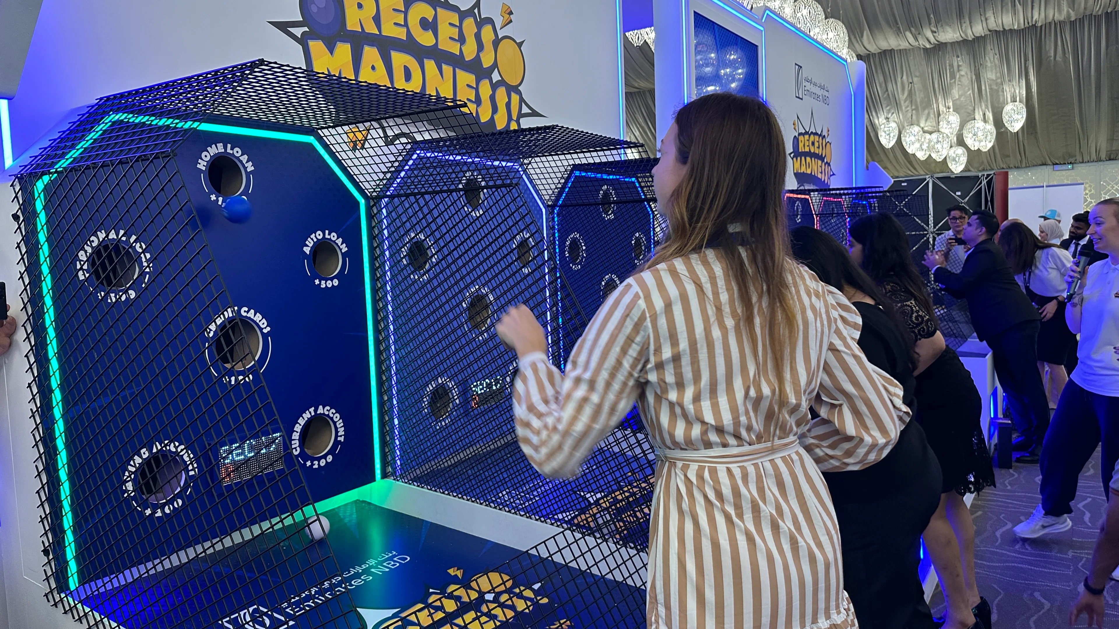 Teachers playing Recess Madness, an arcade-inspired experiential marketing activation for Emirates NBD.