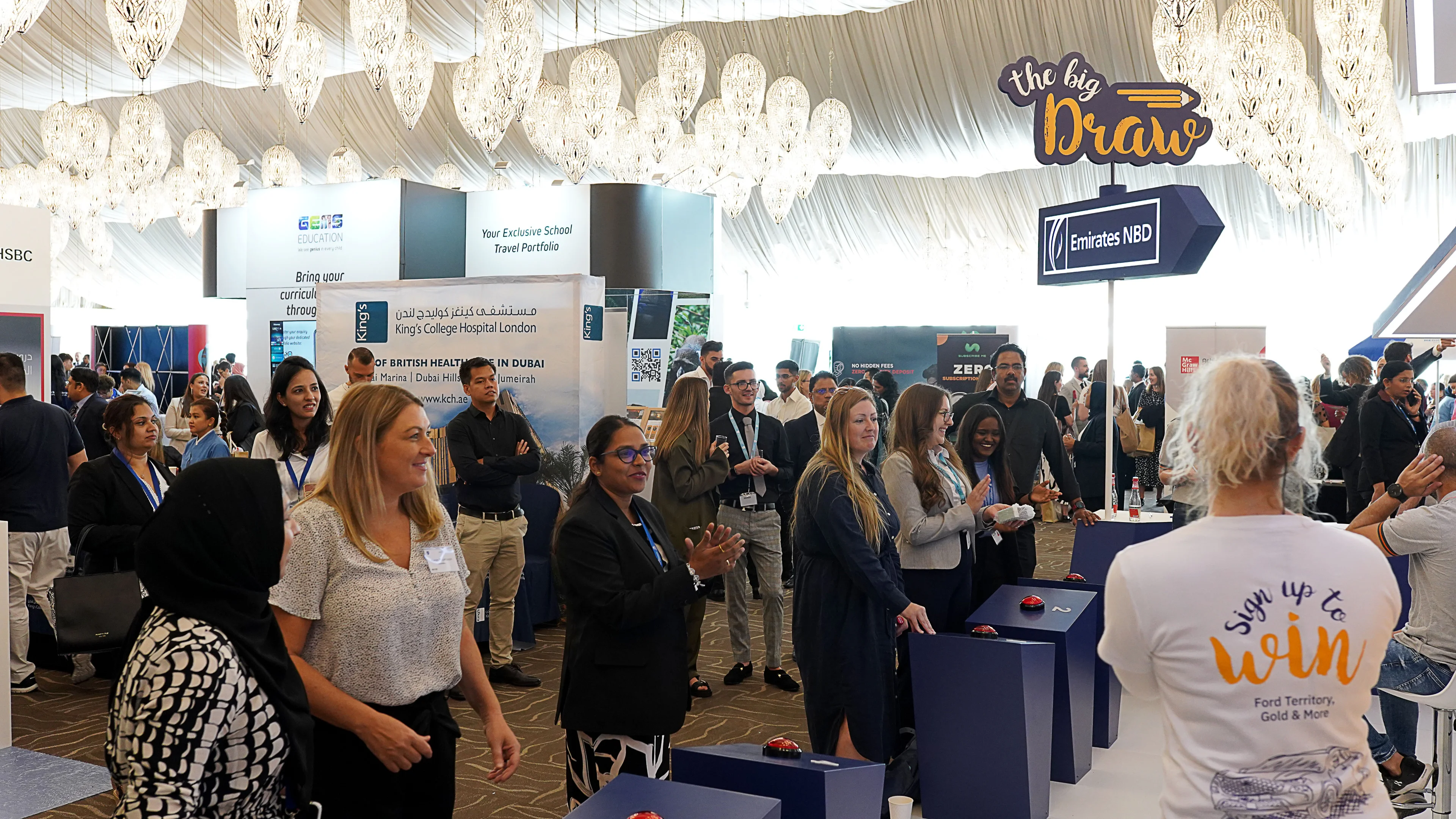 Teachers competing in The Big Draw interactive illustration game during Emirates NBD’s GEMS Awareness Day activation.