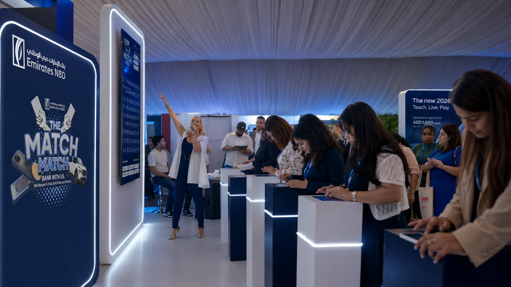 Teachers competing in Match Match, a multiplayer tablet activation for Emirates NBD at GEMS Awareness Day.