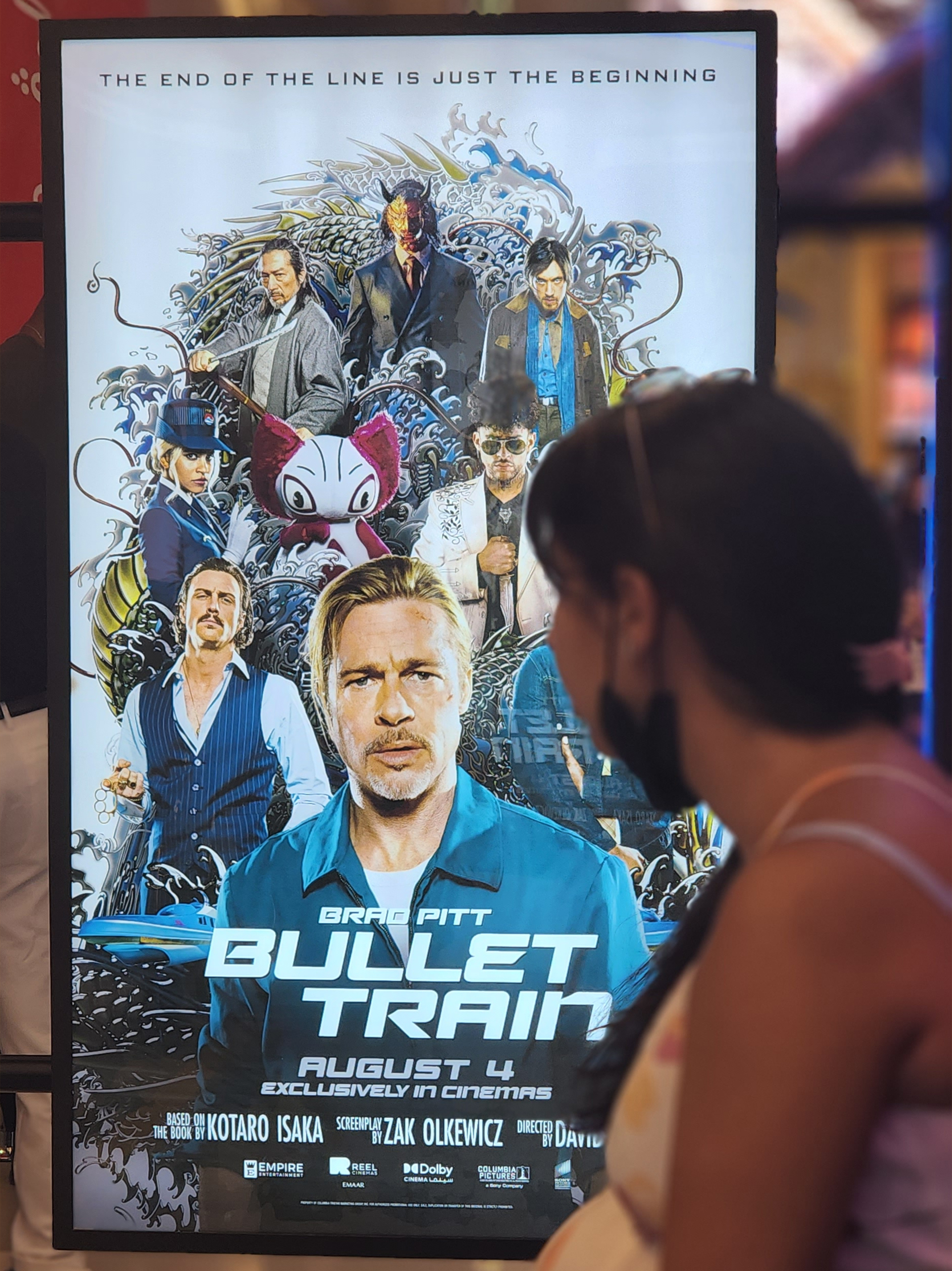 Moviegoer looking at the Bullet Train poster on our activation stand. Moviegoer looking at the Bullet Train poster on our activation stand.