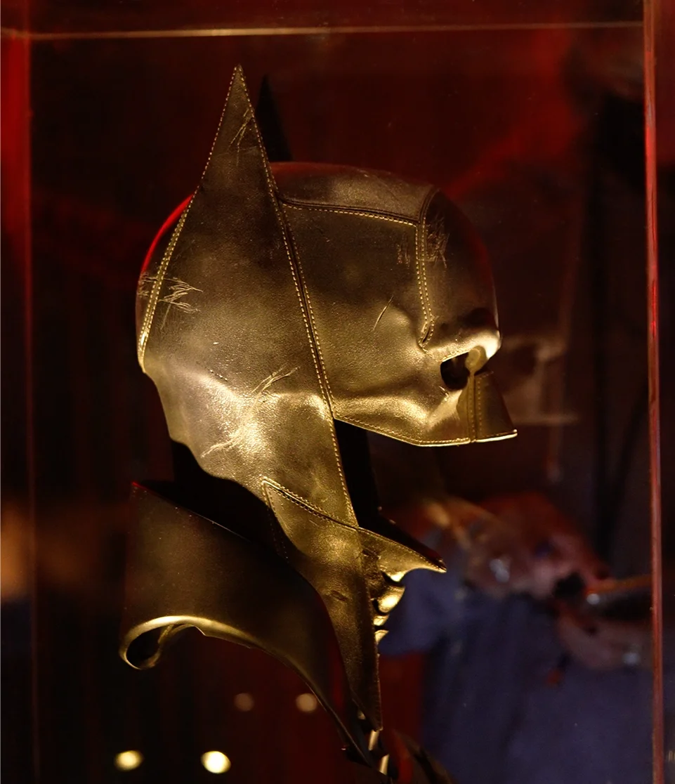 Batman cowl displayed as part of The Batman props inside Gotham City Pavilion