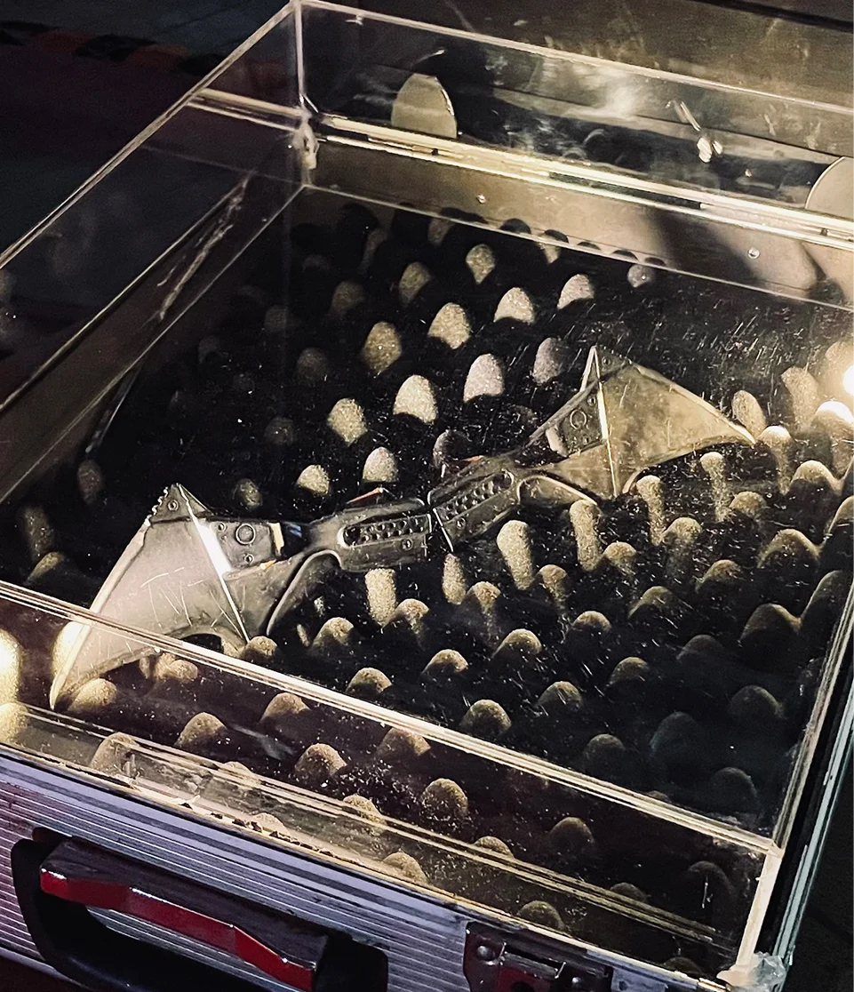 Batman Batarang displayed among props and memorabilia at Gotham City Pavilion